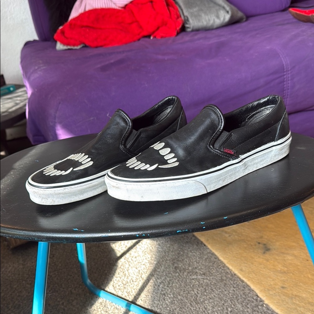 Vans Black Slip-Ons with White fangs